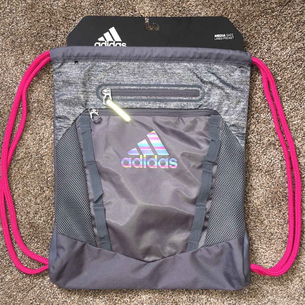 Adidas cinch backpack. New still attached to original backboard.